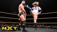 Glorious Bobby Roode eats a big boot from Kassius Ohno.